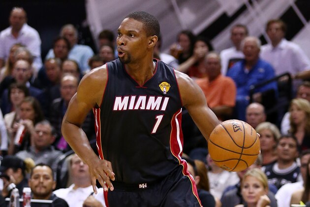 SAN ANTONIO, TX - JUNE 15:  Chris Bosh #1 of the Miami Heat drives to the basket against the San Antonio Spurs during Game Five of the 2014 NBA Finals at the AT&T Center on June 15, 2014 in San Antonio, Texas. NOTE TO USER: User expressly acknowledges and agrees that, by downloading and or using this photograph, User is consenting to the terms and conditions of the Getty Images License Agreement.  (Photo by Andy Lyons/Getty Images)