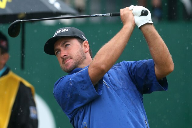 Graeme McDowell of Northern Ireland plays a shot off the 1st tee during the third day of the British Open Golf championship at the Royal Liverpool golf club, Hoylake, England, Saturday July 19, 2014. (AP Photo/Scott Heppell)