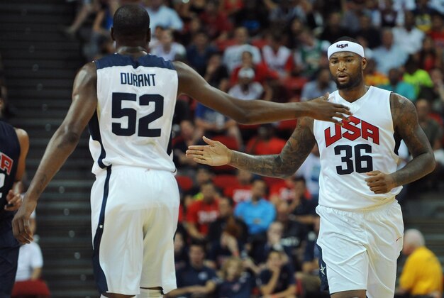 Aug 1, 2014; Las Vegas, NV, USA; USA Team White center DeMarcus Cousins (36) and guard Kevin Durant (52) celebrate after a play during the USA Basketball Showcase at Thomas & Mack Center. Mandatory Credit: Stephen R. Sylvanie-USA TODAY Sports