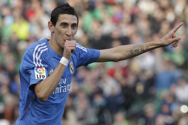 Real Madrid's Angel Di Maria from Argentina reacts after scoring again Betis during their La Liga soccer match at the Benito Villamarin stadium, in Seville, Spain on Saturday, Jan. 18, 2014. (AP Photo/Angel Fernandez)