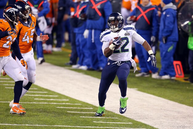 Feb 2, 2014; East Rutherford, NJ, USA; Seattle Seahawks running back Robert Turbin (22) runs against the Denver Broncos during the second half in Super Bowl XLVIII at MetLife Stadium.  Mandatory Credit: Jim O'Connor-USA TODAY Sports