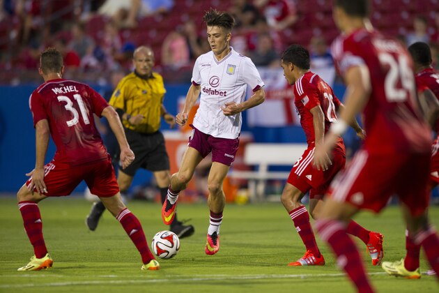 FRISCO, TX - JULY 23:  Jack Grealish #40 of Aston Villa maneuvers through the FC Dallas defense during an international friendly on July 23, 2014 at Toyota Stadium in Frisco, Texas.  (Photo by Cooper Neill/Getty Images)