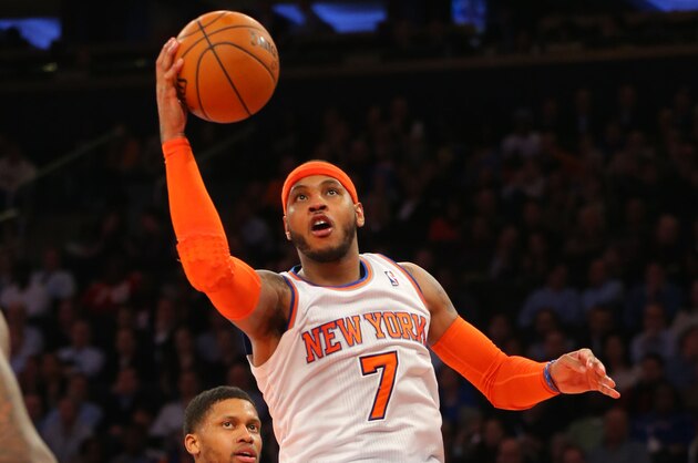 Feb 12, 2014; New York, NY, USA;  New York Knicks small forward Carmelo Anthony (7) drives to the basket during the second half against the Sacramento Kings at Madison Square Garden. Sacramento Kings defeat the New York Knicks 106-101 in OT. Mandatory Credit: Jim O'Connor-USA TODAY Sports