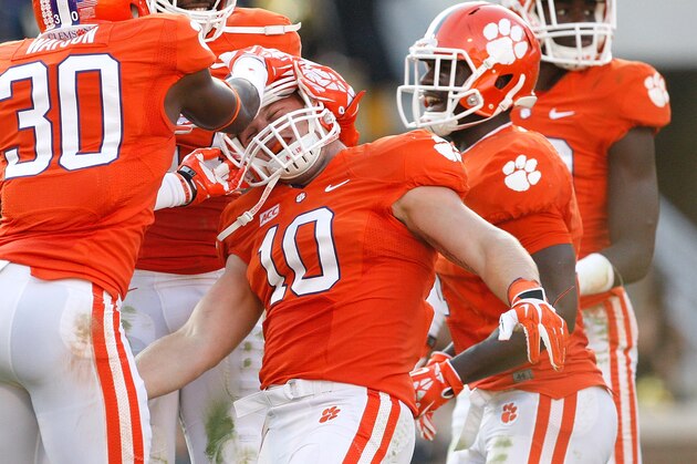 CLEMSON, SC - SEPTEMBER 28: Ben Boulware #10 of the Clemson Tigers celebrates with teammates after making an interception during the game against the Wake Forest Demon Deacons at Memorial Stadium on September 28, 2013 in Clemson, South Carolina. (Photo by Tyler Smith/Getty Images)