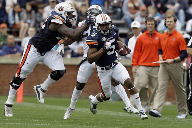 Apr 19, 2014; Auburn, AL, USA;  Auburn Tigers receiver Ricardo Louis (5) carries the ball during the first half of the A-Day spring game at Jordan Hare Stadium. Mandatory Credit: John Reed-USA TODAY Sports