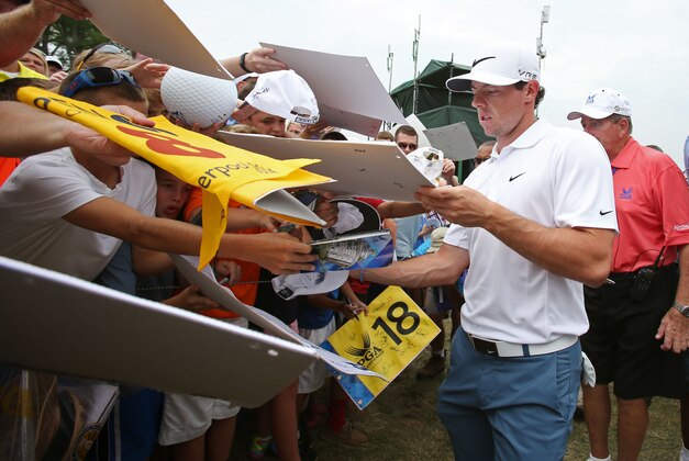 Aug 5, 2014; Louisville, KY, USA; PGA golfer Rory McIlroy signs autographs after walking off the 9th green during practice for the 2014 PGA Championship at Valhalla Country Club. Mandatory Credit: Brian Spurlock-USA TODAY Sports