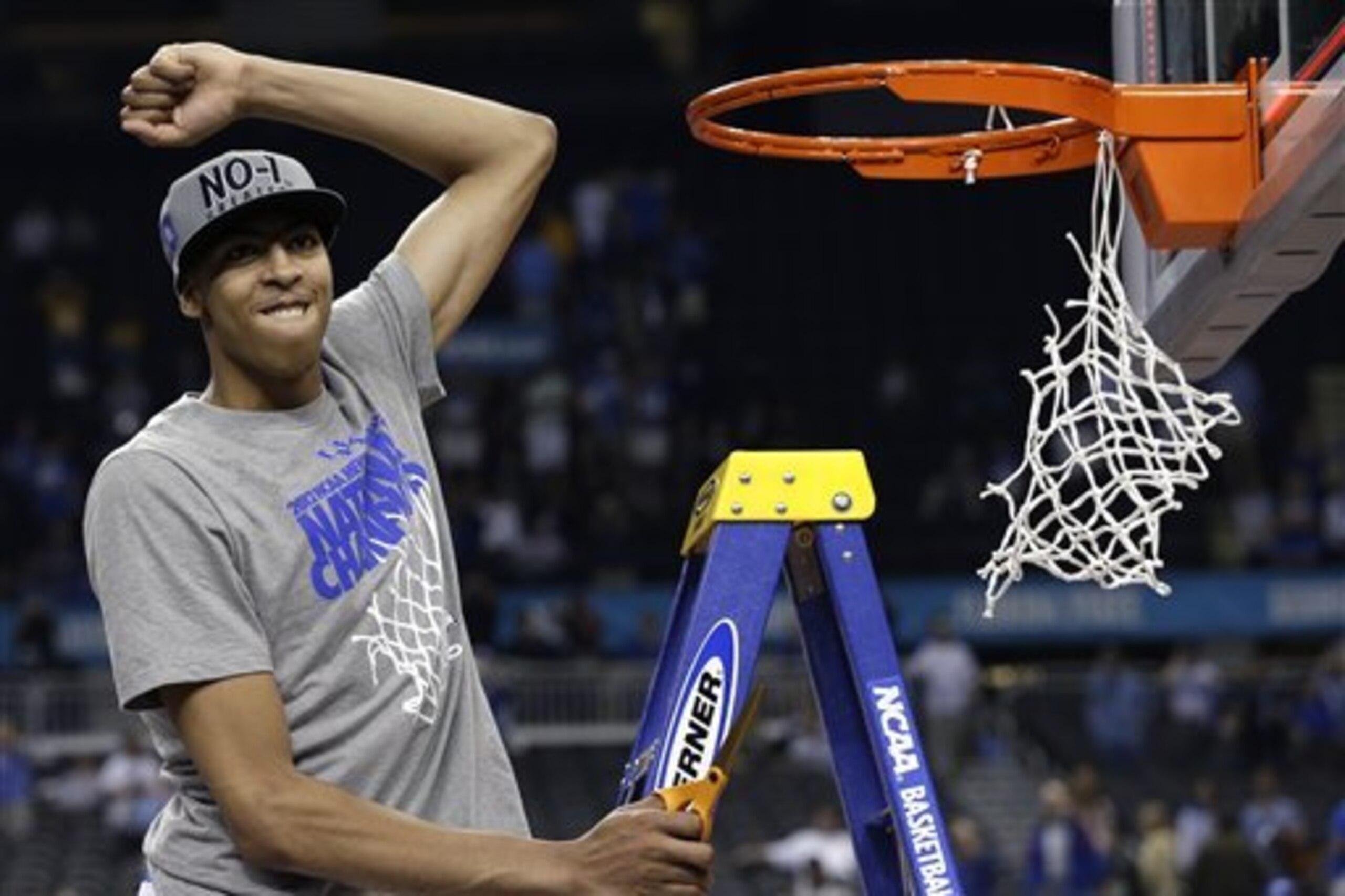 Kentucky forward Anthony Davis celebrates as he cuts the net after the NCAA Final Four tournament college basketball championship game Monday, April 2, 2012, in New Orleans.  Kentucky beat Kansas 67-59.  (AP Photo/David J. Phillip)