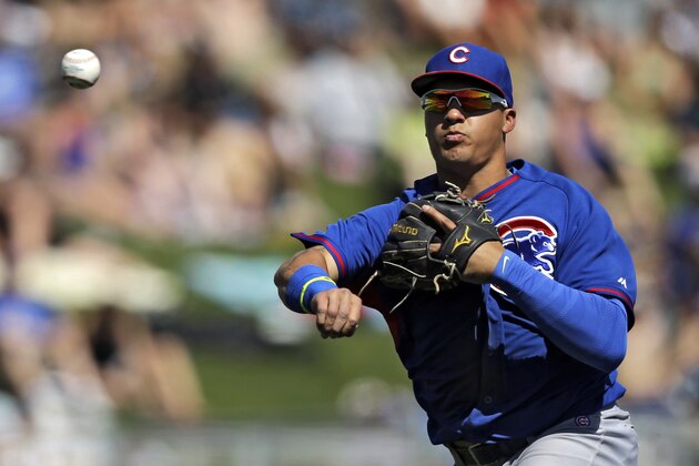 Chicago Cubs shortstop Javier Baez throws out Chicago White Sox's Marcus Semien at first in the fourth inning of a spring exhibition baseball game Friday, March 21, 2014, in Glendale, Ariz. (AP Photo/Mark Duncan)