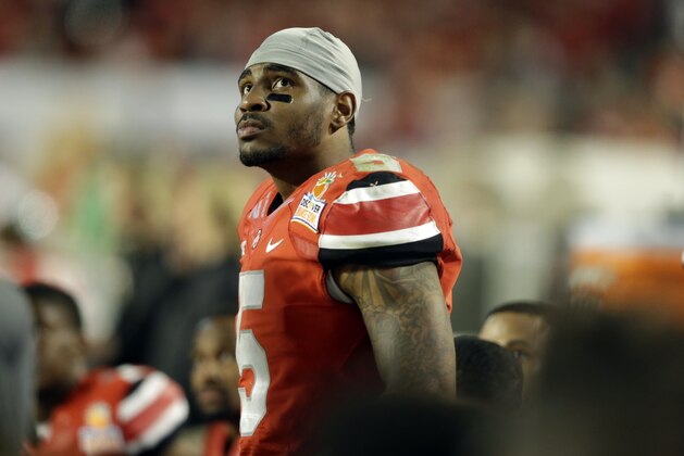 Ohio State quarterback Braxton Miller (5) watches from the sideline during the second half of the Orange Bowl NCAA college football game, Friday, Jan. 3, 2014, in Miami Gardens, Fla. Clemson defeated Ohio State 40-35.  (AP Photo/Wilfredo Lee)