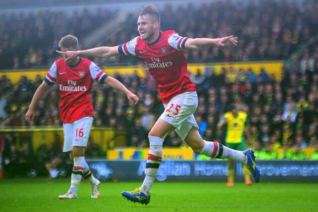 NORWICH, ENGLAND - MAY 11:  Carl Jenkinson of Arsenal celebrates scoring the second goal during the Barclays Premier League match between Norwich City and Arsenal at Carrow Road on May 11, 2014 in Norwich, England.  (Photo by Jamie McDonald/Getty Images)