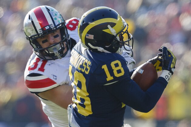 Nov 30, 2013; Ann Arbor, MI, USA; Michigan Wolverines defensive back Blake Countess (18) intercepts the pass intended for Ohio State Buckeyes tight end Nick Vannett (81) in the second quarter at Michigan Stadium. Mandatory Credit: Rick Osentoski-USA TODAY Sports