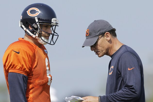 Chicago Bears quarterback Jay Cutler (6), left, listens to head coach Marc Trestman during NFL football training camp at Olivet Nazarene University, Wednesday, July 30, 2014, in Bourbonnais, Ill. (AP Photo/Nam Y. Huh)