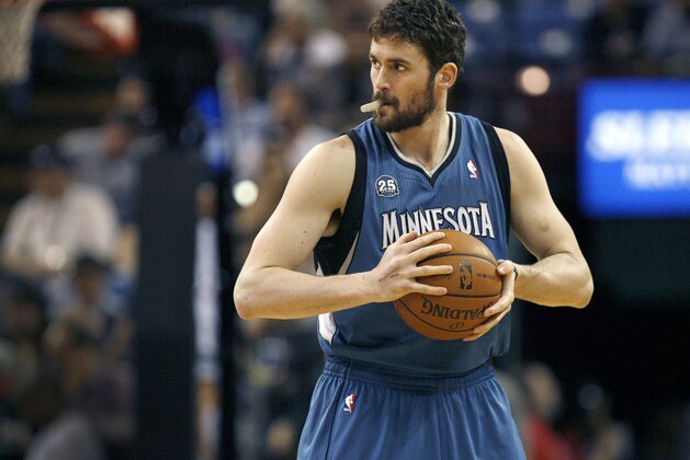 FILE - In this April 13, 2014, file photo, Minnesota Timberwolves forward Kevin Love gets ready to play the Sacramento Kings in Sacramento, Calif.  A person with knowledge of the situation tells The Associated Press that the Timberwolves and Golden State Warriors have restarted trade talks for All-Star forward Kevin Love.  (AP Photo/Steve Yeater, File)