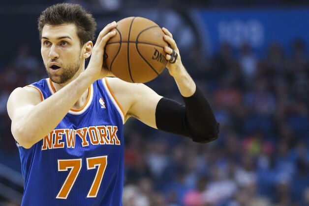 New York Knicks' Andrea Bargnani, of Italy, looks to pass the ball against the Orlando Magic in the first half of an NBA basketball game in Orlando, Fla., Monday, Dec. 23, 2013.(AP Photo/John Raoux)