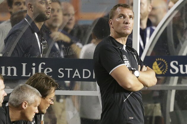 Liverpool's manager Brendan Rodgers, right, looks up at the scoreboard in the second half during the final of the Guinness International Champions Cup soccer match between Liverpool and Manchester United, Monday, Aug. 4,  2014, in Miami Gardens, Fla. Manchester United defeated Liverpool 3-1. (AP Photo/Lynne Sladky)