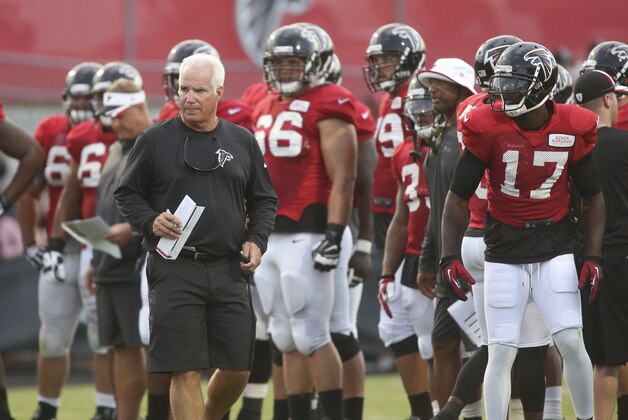 Atlanta Falcons head coach Mike Smith is shown during the Falcons annual event, Friday Night Lights, at Archer High School Friday, Aug. 1, 2014, in Lawrenceville, Ga. The Falcons continued their tradition of staging a practice at an area high school each year. (AP Photo/Jason Getz)
