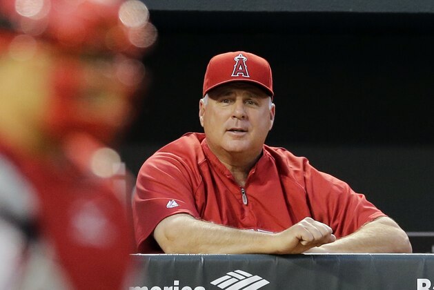 Los Angeles Angels manager Mike Scioscia watches from the dugout during a baseball game against the Baltimore Orioles, Tuesday, July 29, 2014, in Baltimore. (AP Photo/Patrick Semansky)