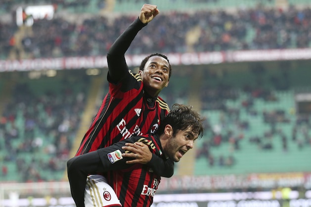 AC Milan Brazilian forward Kaka, bottom, celebrates with his teammate Brazilian forward Robinho after scoring during the Serie A soccer match between AC Milan and Atalanta at the San Siro stadium in Milan, Italy, Monday, Jan. 6, 2014. (AP Photo/Antonio Calanni)
