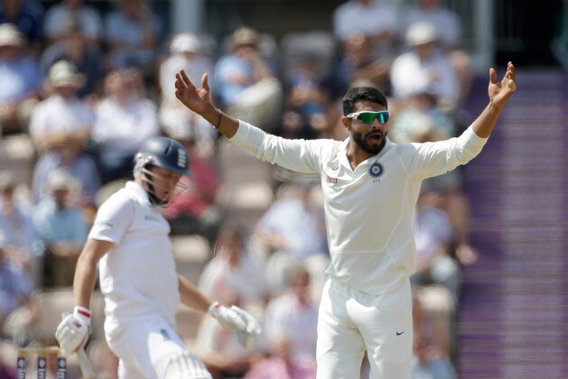 India's Ravindra Jadeja successfully appeals for the wicket of England's Gary Ballance, left, during the fourth day of the third cricket Test match of the series between England and India at The Ageas Bowl in Southampton, England, Wednesday, July 30, 2014.  (AP Photo/Matt Dunham)