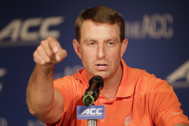 Clemson head coach Dabo Swinney answers a question during a news conference at the Atlantic Coast Conference Football kickoff in Greensboro, N.C., Monday, July 21, 2014. (AP Photo/Chuck Burton)