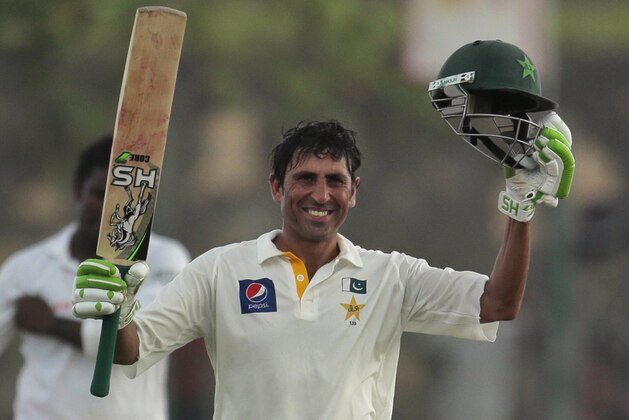Pakistan's batsman Younis Khan  celebrates scoring a century during the first day's play of the first test cricket match between Sri Lanka and Pakistan in Galle, Sri Lanka, Wednesday, Aug. 6, 2014. (AP Photo/Eranga Jayawardena)