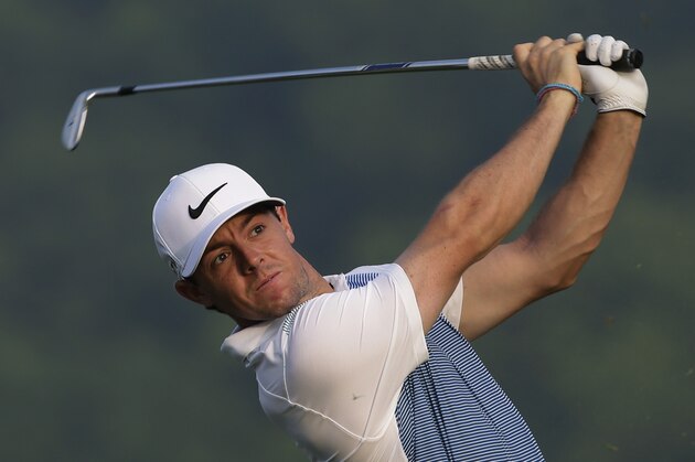 Rory McIlroy, of Northern Ireland, hits his tee shot on the eighth hole during a practice round for the PGA Championship golf tournament at Valhalla Golf Club on Wednesday, Aug. 6, 2014, in Louisville, Ky. The tournament is set to begin on Thursday. (AP Photo/David J. Phillip)