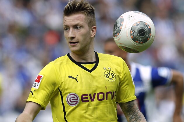 Dortmund's Marco Reus plays the ball during the German Bundesliga soccer match between Hertha BSC Berlin and Borussia Dortmund in Berlin, Germany, Saturday, May 10, 2014. Dortmund defeated Hertha by 4-0. (AP Photo/Michael Sohn)