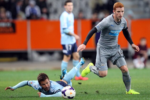 DUNEDIN, NEW ZEALAND - JULY 22:  Milos Dimitrijevic of Sydney FC and Newcastle United Jack Colback compete for the ball during the international friendly match between Newcastle United and Sydney FC at Forsyth Barr Stadium on July 22, 2014 in Dunedin, New Zealand.  (Photo by Rob Jefferies/Getty Images)