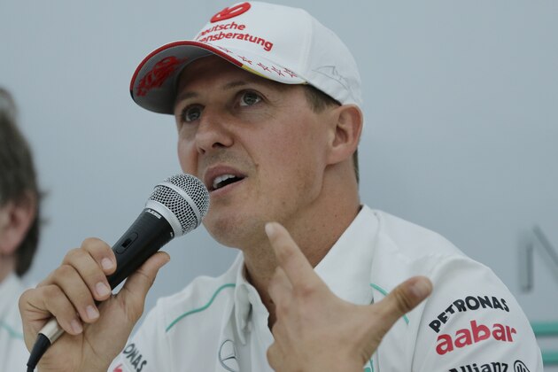 Mercedes driver Michael Schumacher announces his retirement from Formula One at the end of the 2012 season during a press conference at the Suzuka Circuit venue for the Japanese Formula One Grand Prix in Suzuka, Japan, Thursday, Oct. 4, 2012. (AP Photo/Shizuo Kambayashi)