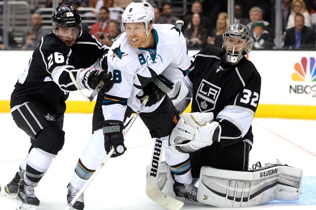 LOS ANGELES, CA - APRIL 24:  Joe Pavelski #8 of the San Jose Sharks provides a screen in front of Jonathan Quick #32 of the Los Angeles Kings as Slava Voynov #26 attempts to move him during the first period in Game Four of the First Round of the 2014 NHL Stanley Cup Playoffs at Staples Center on April 24, 2014 in Los Angeles, California.  (Photo by Harry How/Getty Images)