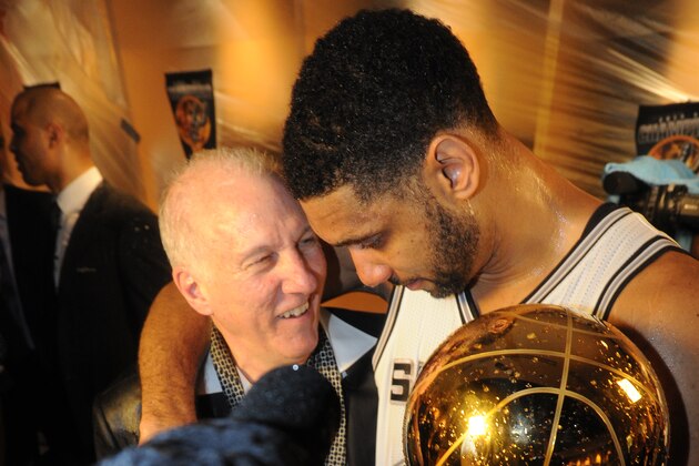 SAN ANTONIO, TX - JUNE 15: Tim Duncan #21 and Head Coach Gregg Popovich of the San Antonio Spurs celebrates after winning the NBA Championship against the Miami Heat during Game Five of the 2014 NBA Finals between the Miami Heat and San Antonio Spurs at AT&T Center on June 15, 2014 in San Antonio, Texas. NOTE TO USER: User expressly acknowledges and agrees that, by downloading and/or using this photograph, user is consenting to the terms and conditions of the Getty Images License Agreement.  Mandatory Copyright Notice: Copyright 2014 NBAE (Photo by Andrew D Bernstein/NBAE via Getty Images)