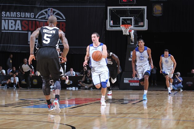 LAS VEGAS, NV - JULY 18: Aaron Craft #4 of the Golden State Warriors moves the ball up-court against the Milwaukee Bucks at the Samsung NBA Summer League 2014 on July 18, 2014 at the Thomas & Mack Center in Las Vegas, Nevada. NOTE TO USER: User expressly acknowledges and agrees that, by downloading and or using this photograph, User is consenting to the terms and conditions of the Getty Images License Agreement. Mandatory Copyright Notice: Copyright 2014 NBAE (Photo by Jack Arent/NBAE via Getty Images)