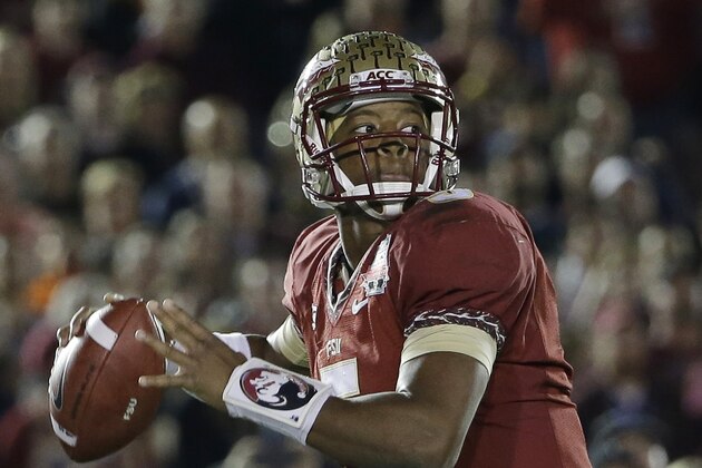 Florida State's Jameis Winston (5) throws during the first half of the NCAA BCS National Championship college football game against Auburn Monday, Jan. 6, 2014, in Pasadena, Calif.(AP Photo/David J. Phillip)