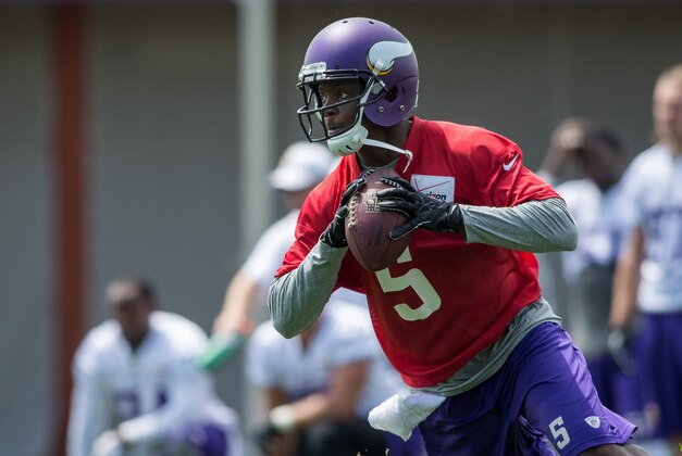 Jun 17, 2014; Eden Prairie, MN, USA; Minnesota Vikings quarterback Teddy Bridgewater (5) scrambles in drills at Winter Park. Mandatory Credit: Bruce Kluckhohn-USA TODAY Sports