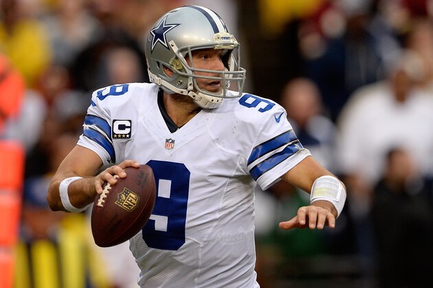 LANDOVER, MD - DECEMBER 22:  Quarterback Tony Romo #9 of the Dallas Cowboys scrambles with the ball in the second half during an NFL game against the Washington Redskins at FedExField on December 22, 2013 in Landover, Maryland.  (Photo by Patrick McDermott/Getty Images)