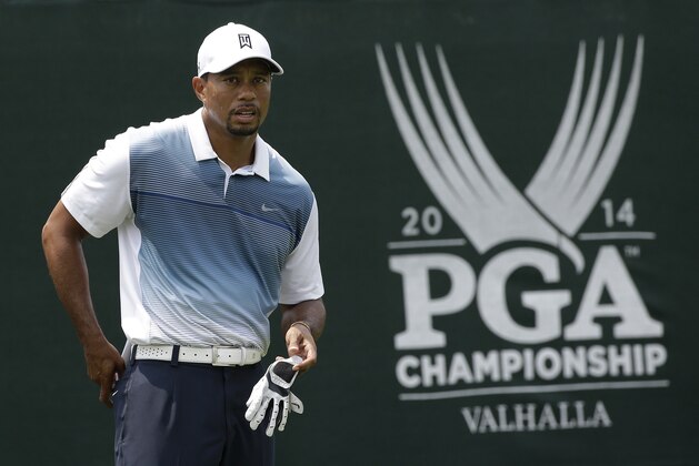 Tiger Woods stands on the first tee during a practice round for the PGA Championship golf tournament at Valhalla Golf Club on Wednesday, Aug. 6, 2014, in Louisville, Ky. The tournament is set to begin on Thursday. (AP Photo/David J. Phillip)