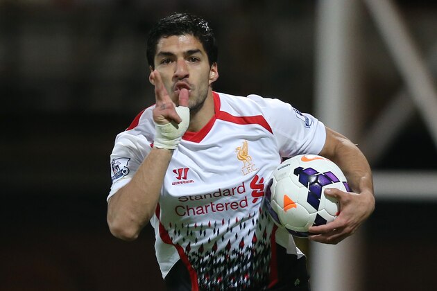 Liverpool's Luis Suarez celebrates after scoring his side's third goal, during the English Premier League soccer match between Crystal Palace and Liverpool at Selhurst Park stadium in London, Monday, May 5, 2014. (AP Photo/Alastair Grant)