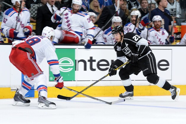 LOS ANGELES, CA - JUNE 13:  Dustin Brown #23 of the Los Angeles Kings skates against Marc Staal #18 of the New York Rangers during the second period of Game Five of the 2014 NHL Stanley Cup Final at Staples Center on June 13, 2014 in Los Angeles, California. (Photo by Andrew D. Bernstein/NHLI via Getty Images)