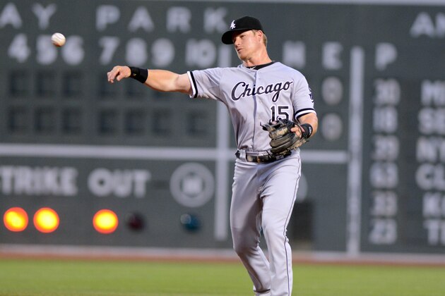 BOSTON, MA - JULY 7: Gordon Beckham #15 of the Chicago White Sox throws to first base in the second inning against the Boston Red Sox at Fenway Park on July 7, 2014 in Boston, Massachusetts. The White Sox won the game 4-0. (Photo by Darren McCollester/Getty Images)