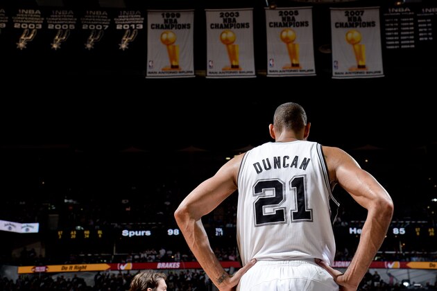 SAN ANTONIO, TX - JUNE 16: Tim Duncan #21 of the San Antonio Spurs stands under the team's four Championship banners while playing the Miami Heat during Game Five of the 2013 NBA Finals on June 16, 2013 at AT&T Center in San Antonio, Texas. NOTE TO USER: User expressly acknowledges and agrees that, by downloading and or using this photograph, User is consenting to the terms and conditions of the Getty Images License Agreement. Mandatory Copyright Notice: Copyright 2013 NBAE (Photo by D. Clarke Evans/NBAE via Getty Images)