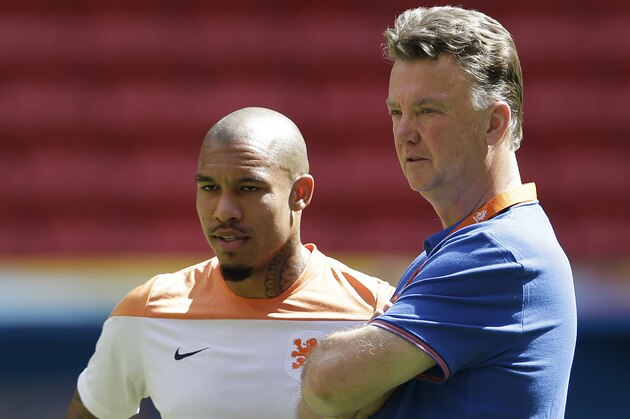 Netherlands head coach Louis van Gaal, right, and player Nigel de Jong attend a training session at the Estadio Nacional  in Brasilia, Brazil, Friday, July 11, 2014. The Netherlands will face Brazil in the World Cup third-place match Saturday. (AP Photo/Andre Penner)