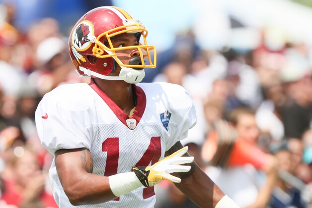 Washington Redskins WR Ryan Grant looks for a pass from Robert Griffin III before an NFL Football training camp scrimmage of New England Patriots and  Washington Redskins in Richmond, Va., Tuesday, Aug. 5, 2014. (AP Photo/Skip Rowland)
