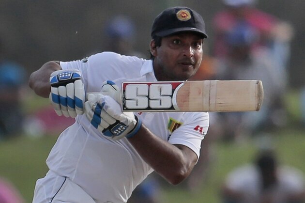 Sri Lankan batsman Kumar Sangakkara plays a shot during the second day's play of the first test cricket match between Sri Lanka and Pakistan in Galle, Sri Lanka, Thursday, Aug. 7, 2014. (AP Photo/Eranga Jayawardena)