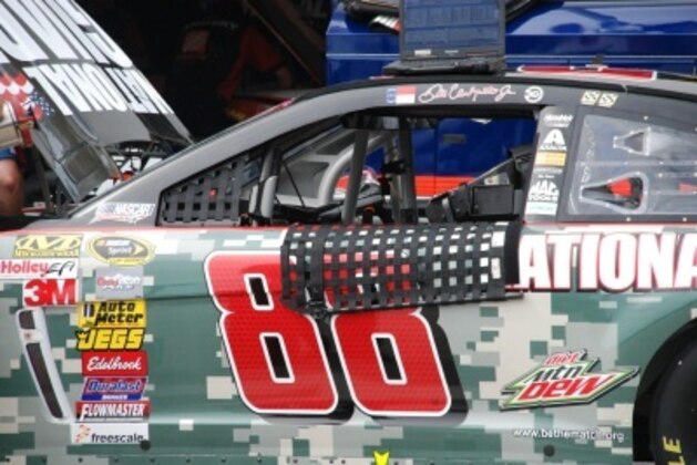 Dale Earnhardt Jr.'s No.88 car getting work during practice in the Daytona garage