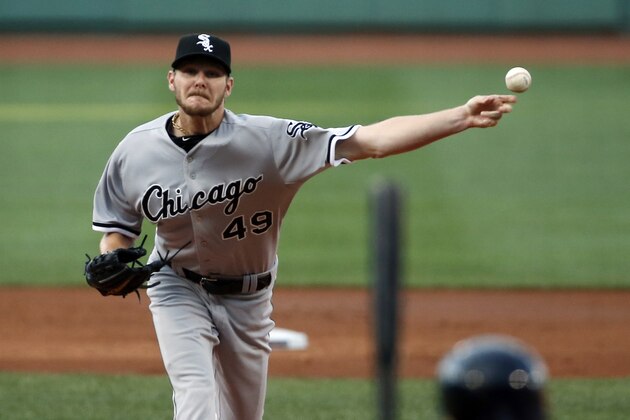 Chicago White Sox starting pitcher Chris Sale delivers to the Boston Red Sox in the first inning of a baseball game at Fenway Park in Boston, Wednesday, July 9, 2014. (AP Photo/Elise Amendola)