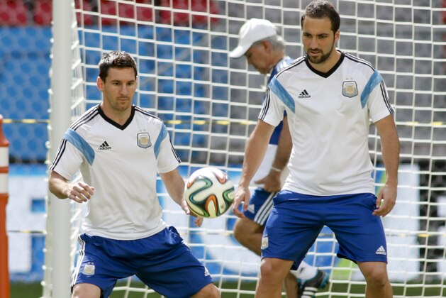 Argentina's Lionel Messi, left, and Argentina's Gonzalo Higuain take part in a training session at Estadio Nacional in Brasilia, Brazil, Friday, July 4, 2014. On Saturday, Argentina will face Belgium in their World Cup quarterfinals soccer match. (AP Photo/Eraldo Peres)