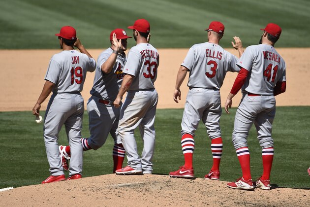 SAN DIEGO, CA - JULY 31:  St. Louis Cardinals players high-five after beating the San Diego Padres 6-2 in a baseball game at Petco Park July 31, 2014 in San Diego, California.  (Photo by Denis Poroy/Getty Images)