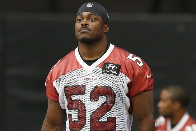 Arizona Cardinals' Ernie Sims walks on the field during the first day of NFL football training camp on Saturday, July 26, 2014, in Glendale, Ariz. (AP Photo/Ross D. Franklin)