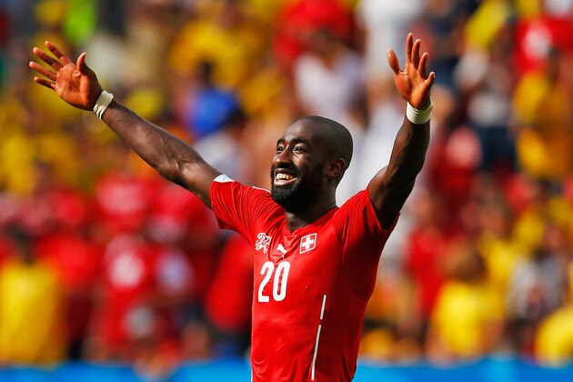 BRASILIA, BRAZIL - JUNE 15:  Johan Djourou of Switzerland celebrates after defeating Ecuador 2-1 during the 2014 FIFA World Cup Brazil Group E match between Switzerland and Ecuador at Estadio Nacional on June 15, 2014 in Brasilia, Brazil.  (Photo by Matthew Lewis/Getty Images)