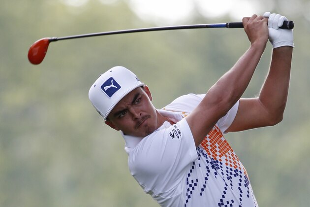 Rickie Fowler watches his tee shot on the first hole during the first round of the PGA Championship golf tournament at Valhalla Golf Club on Thursday, Aug. 7, 2014, in Louisville, Ky. (AP Photo/Mike Groll)